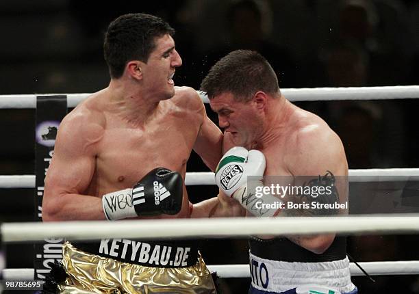 Marco Huck of Germany and Brian Minto of the U.S. Exchange punches during their WBO World Championship Cruiserweight title fight at the...