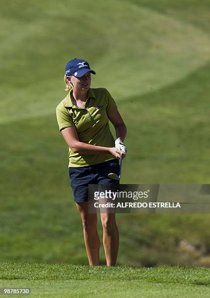 Golfer Stacy Lewis reacts after her shot at the 18th hole during the third round of the Tres Marias Championship Open of the LPGA Tour at Tres Marias...