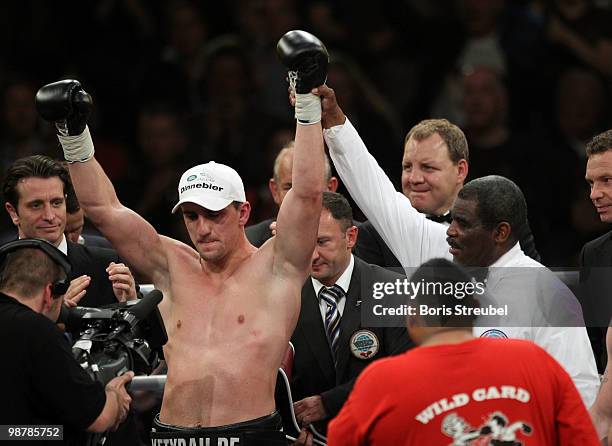 Marco Huck of Germany celebrates after winning the WBO World Championship Cruiserweight title fight against Brian Minto at the Weser-Ems-Halle on May...