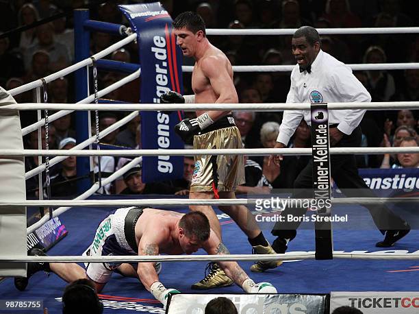 Brian Minto of the U.S. Falls to the ringfloor during his WBO World Championship Cruiserweight title fight against Marco Huck of Germany at the...