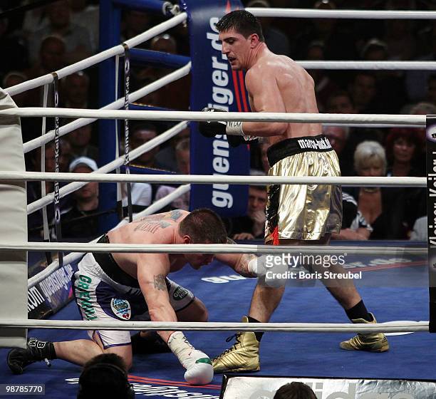 Brian Minto of the U.S. Falls to the ringfloor during his WBO World Championship Cruiserweight title fight against Marco Huck of Germany at the...