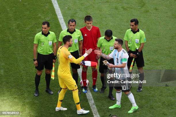 Hugo Lloris of France shakes hands with Lionel Messi of Argentina during the 2018 FIFA World Cup Russia Round of 16 match between France and...