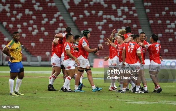 Sunwolves celebrate after the end of the Super Rugby match between Sunwolves and Bulls at the Singapore National Stadium on June 30, 2018 in...
