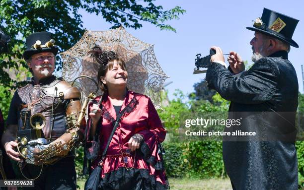 June 2018, Germany, Poessneck: fantastically clothed participants arriving for the steampunk festival in the Shedhalle. The Meissner association "Mit...