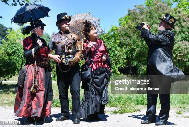 June 2018, Germany, Poessneck: fantastically clothed participants arriving for the steampunk festival in the Shedhalle. The Meissner association "Mit...