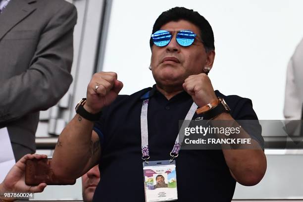 Argentinian football legend Diego Maradona gestures before the Russia 2018 World Cup round of 16 football match between France and Argentina at the...