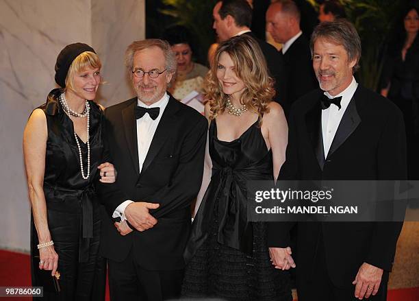 Director Steven Spielberg and his wife Kate Kate Capshaw poses with actress Michelle Pfeiffer and David E. Kelley as they arrive for the 2010 White...