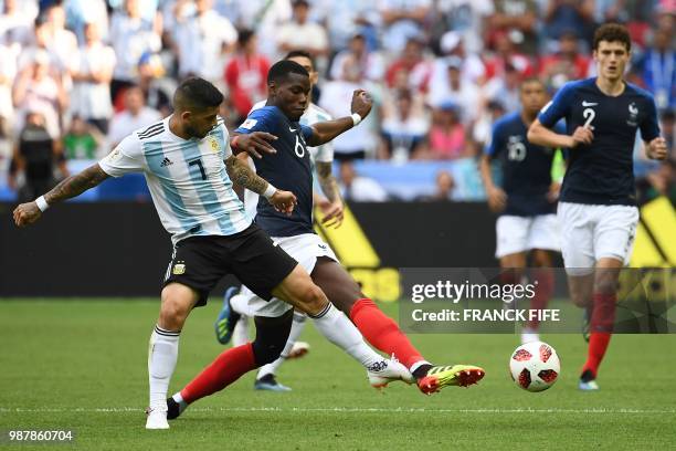 Argentina's midfielder Ever Banega vies with France's midfielder Paul Pogba during the Russia 2018 World Cup round of 16 football match between...