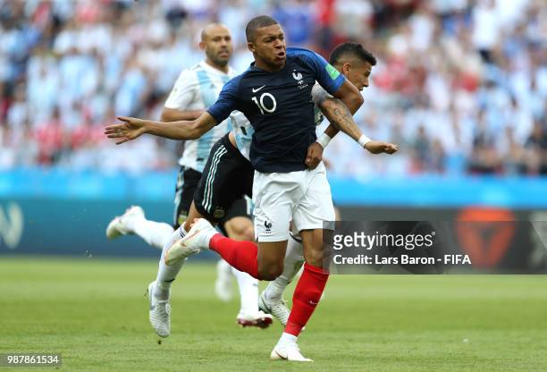 Marcos Rojo of Argentina fouls Kylian Mbappe of France to concede a penalty during the 2018 FIFA World Cup Russia Round of 16 match between France...