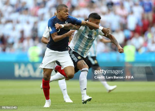 Marcos Rojo of Argentina fouls Kylian Mbappe of France to concede a penalty during the 2018 FIFA World Cup Russia Round of 16 match between France...