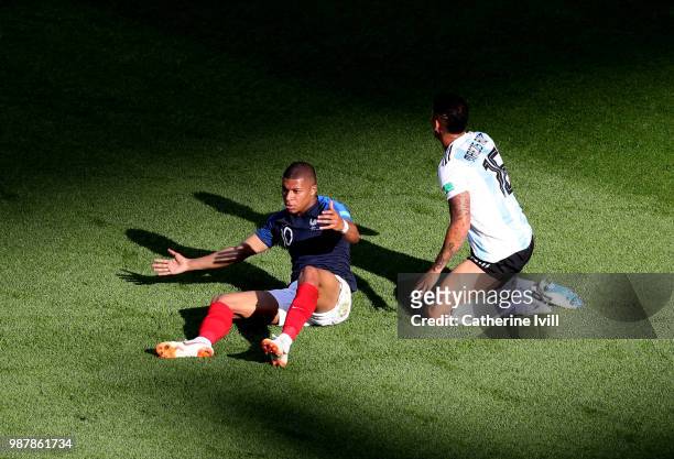 Kylian Mbappe of France reacts after rbeing fouled inside the box by Marcos Rojo of Argentina during the 2018 FIFA World Cup Russia Round of 16 match...