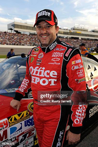 Tony Stewart, driver of the Office Depot / Old Spice Chevrolet, looks on during the NASCAR Sprint Cup Series Crown Royal Presents the Heath Calhoun...