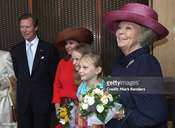 Grand Duke Henri of Luxembourg, Grand Duchess Maria Teresa of Luxembourg and Queen Beatrix of the Netherlands pose with two young girls as they...