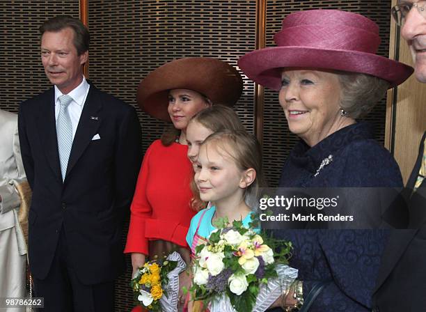 Grand Duke Henri of Luxembourg, Grand Duchess Maria Teresa of Luxembourg and Queen Beatrix of the Netherlands pose with two young girls as they...