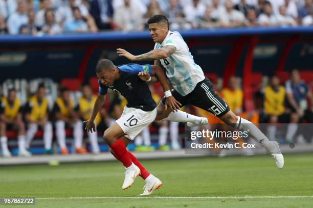 Marcos Rojo of Argentina fouls Kylian Mbappe of France to concede a penalty during the 2018 FIFA World Cup Russia Round of 16 match between France...