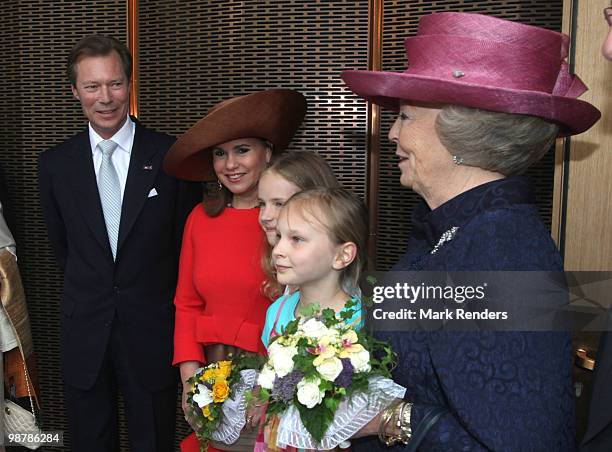 Grand Duke Henri of Luxembourg, Grand Duchess Maria Teresa of Luxembourg and Queen Beatrix of the Netherlands pose with two young girls as they...