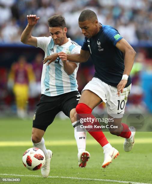Nicolas Tagliafico of Argentina fouls Kylian Mbappe of France, leading to a free kick outside the penalty area, during the 2018 FIFA World Cup Russia...