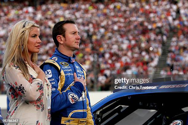 Kurt Busch, driver of the Miller Lite Dodge, stands with his wife Eva on the grid prior to the start of the the NASCAR Sprint Cup Series Crown Royal...