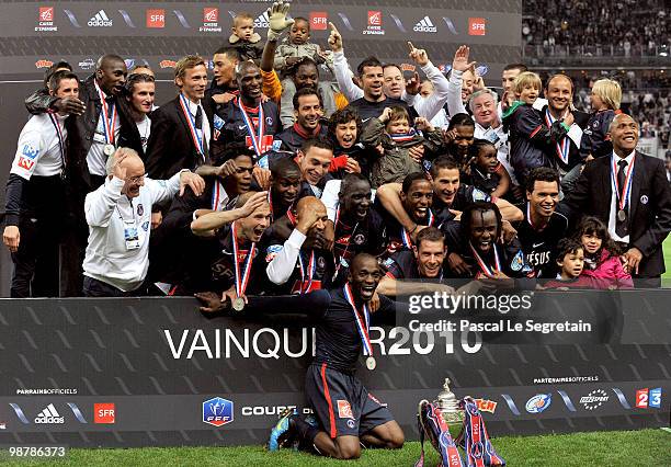 French midfielder and captain Claude Makelele celebrates with the Paris Saint Germain football club teammates after winning the French football Cup...