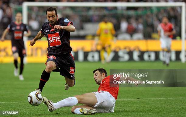 Paris Saint-Germain's French striker Ludovic Giuly battle for the ball with defender of A.S Monaco Thomas Mangani during French football cup final at...