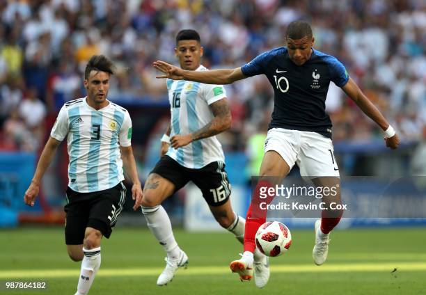 Kylian Mbappe of France controls the ball during the 2018 FIFA World Cup Russia Round of 16 match between France and Argentina at Kazan Arena on June...