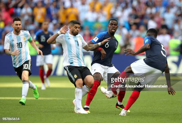 Ever Banega of Argentina battles for possession with fra6a and Samuel Umtiti of France during the 2018 FIFA World Cup Russia Round of 16 match...