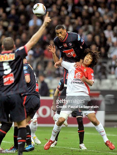 Paris Saint-Germain's French striker Guillaume Hoarau battles for the ball with A.S Monaco striker Chu Young Park during the French football cup...