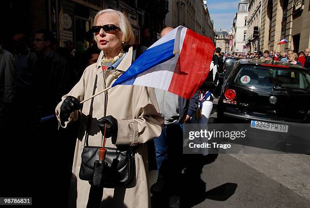 Women carries a flag during the French far right party 'Front National' May Day demonstration n May 1, 2010 in Paris, France. Marine Le Pen the...