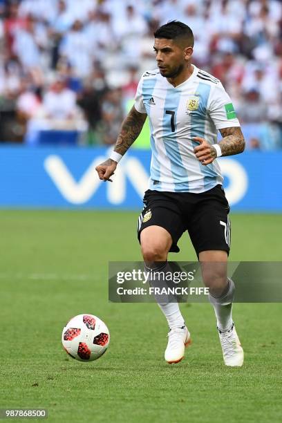 Argentina's midfielder Ever Banega drives the ball during the Russia 2018 World Cup round of 16 football match between France and Argentina at the...