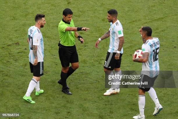 Ever Banega of Argentina confronts referee Alireza Faghani during the 2018 FIFA World Cup Russia Round of 16 match between France and Argentina at...