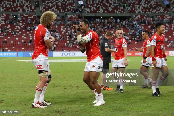 Willie Britz and Semisi Masirewa of the Sunwolves celebrate after the end of the Super Rugby match between Sunwolves and Bulls at the Singapore...