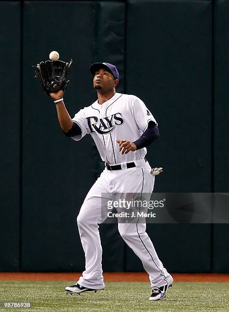 Outfielder Carl Crawford of the Tampa Bay Rays catches a fly ball against the Kansas City Royals during the game at Tropicana Field on May 1, 2010 in...