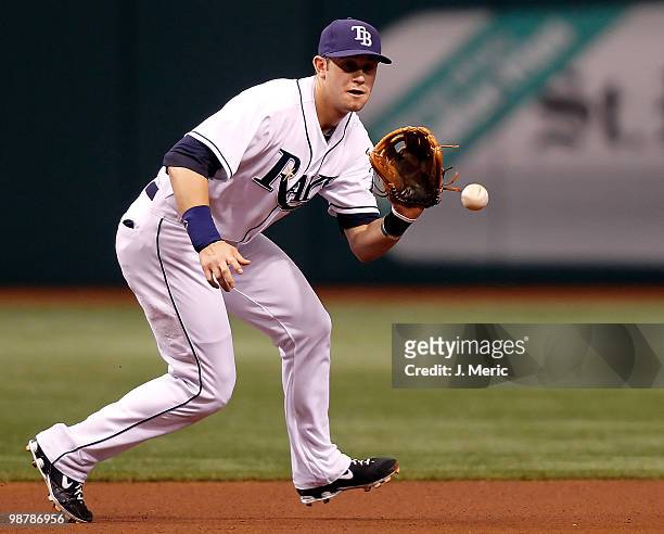 Infielder Evan Longoria of the Tampa Bay Rays fields a ground ball against the Kansas City Royals during the game at Tropicana Field on May 1, 2010...