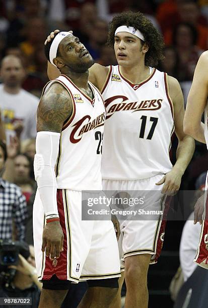 LeBron James of the Cleveland Cavaliers reacts next to Anderson Varejao after missing a layup against the Boston Celtics in Game One of the Eastern...