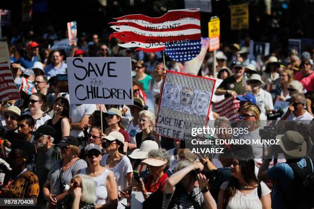 Demonstrators march against the separation of immigrant families, on June 30, 2018 in New York. - Demonstrations are being held across the US...