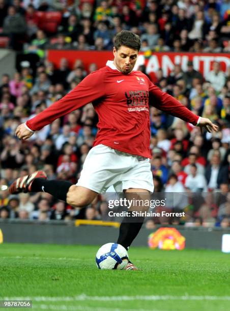 Keith Duffy plays football at United For Relief: The Big Red Family Day Out at Old Trafford on May 1, 2010 in Manchester, England.