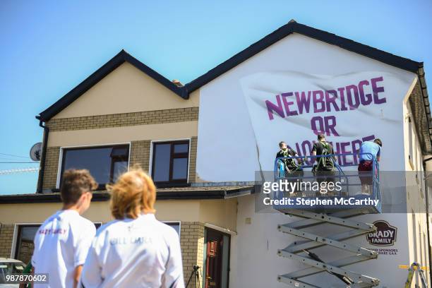 Kildare , Ireland - 30 June 2018; Kildare supporters watch a mural being painted outside St Conleth's Park prior to the GAA Football All-Ireland...
