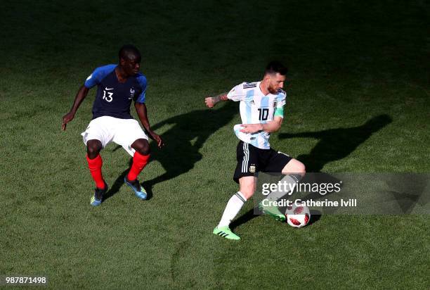 Ngolo Kante of France puts pressure on Lionel Messi of Argentina during the 2018 FIFA World Cup Russia Round of 16 match between France and Argentina...