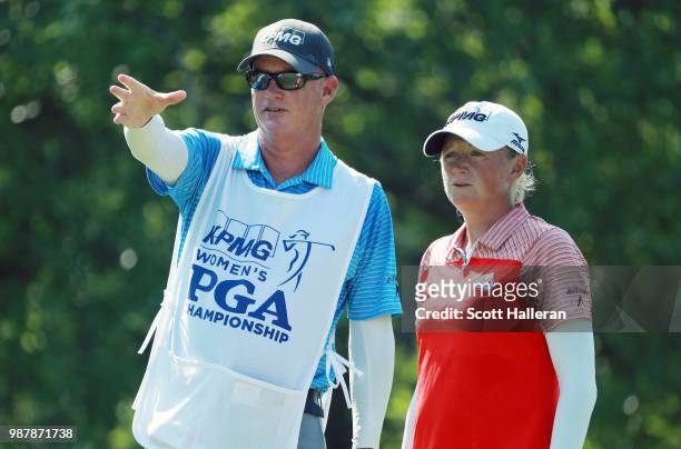 Stacy Lewis lines up her tee shot on the ninth hole with her caddie Travis Wilson during the third round of the KPMG Women's PGA Championship at...