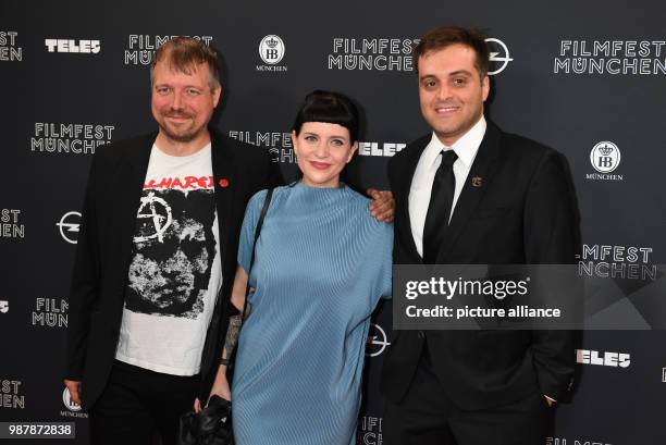June 2018, Germany, Munich: Actor Michl Krenner, , actress Sophia Lierl and director Peter Azen on the red carpet at the opening of Filmfest Muenchen...