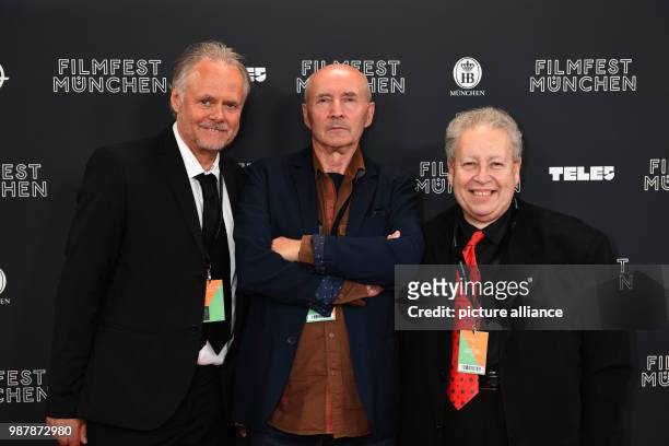 June 2018, Germany, Munich: The Fipresci Jury Jan Storo Andrzej Folger and Peter Krausz on the red carpet at the opening of Filmfest Muenchen 2018 at...