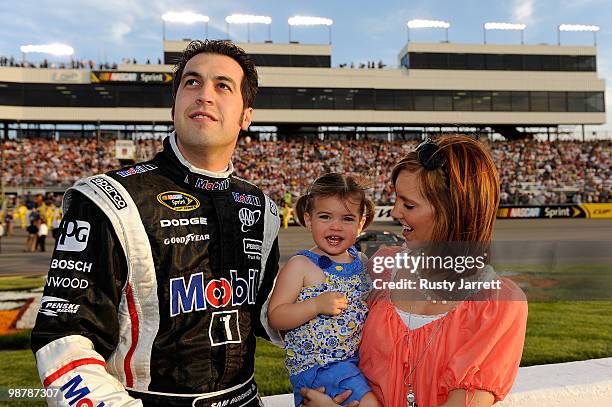 Sam Hornish Jr., driver of the Mobil 1 Dodge, stands on the grid with his wife Crystal and daugher Addison prior to the start of the NASCAR Sprint...