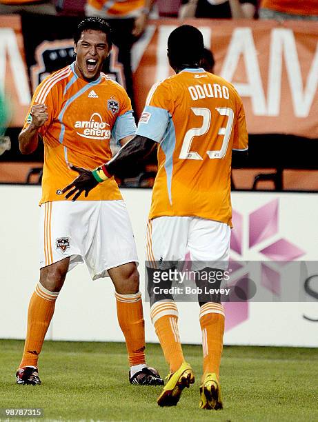 Luis Landin, left, of the Houston Dynamo celebrates with Dominic Oduro after scoring in the first half against the Kansas City Wizards at Robertson...