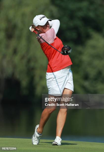 Stacy Lewis hits her tee shot on the seventh hole during the third round of the KPMG Women's PGA Championship at Kemper Lakes Golf Club on June 30,...