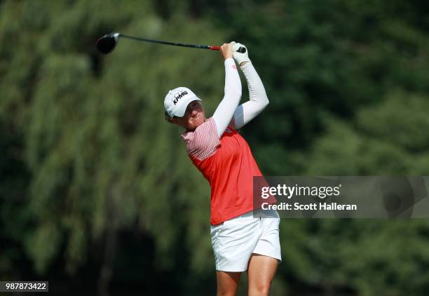 Stacy Lewis hits her tee shot on the seventh hole during the third round of the KPMG Women's PGA Championship at Kemper Lakes Golf Club on June 30,...