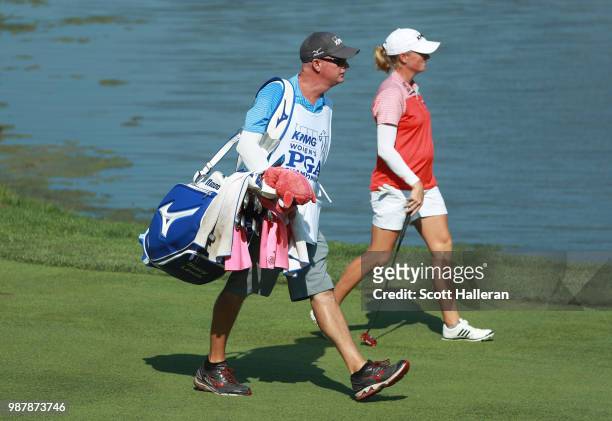 Stacy Lewis walks on the seventh hole with her caddie Travis Wilson during the third round of the KPMG Women's PGA Championship at Kemper Lakes Golf...