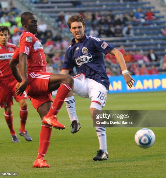 Patrick Nyarko of the Chicago Fire and Blair Gavin of the Chivas USA go for the ball in an MLS match on May 1, 2010 at Toyota Park in Brideview,...