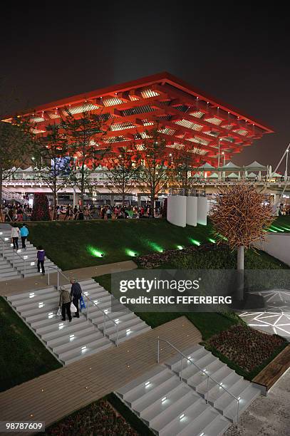 People pass by the Chinese pavilion at the World Expo in Shanghai on May 1, 2010. Shanghai unveiled to the world its multi-billion dollar World Expo,...