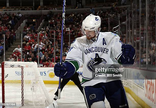 Henrik Sedin of the Vancouver Canucks celebrates scoring the third goal against the Chicago Blackhawks at Game One of the Western Conference...