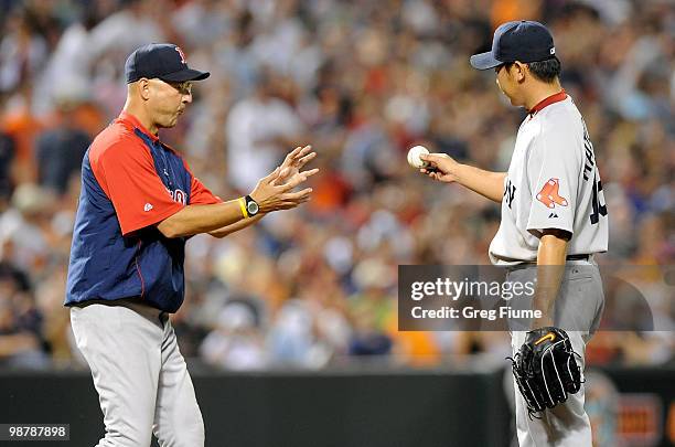 Manager Terry Francona of the Boston Red Sox removes Daisuke Matsuzaka in the fifth inning of the game against the Baltimore Orioles at Camden Yards...
